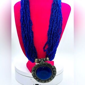Bohemian blue glass bead and blue glass pendant necklace.